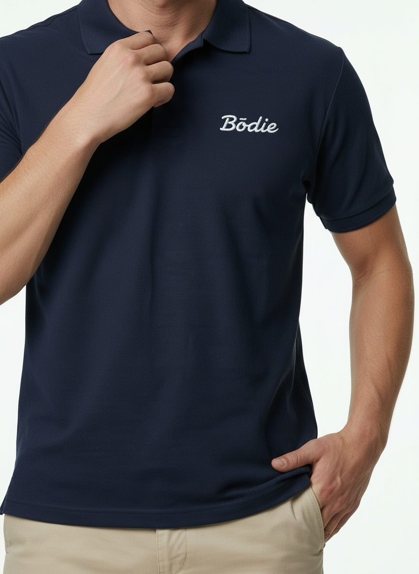 Bōdie Embroidered polo shirt. Navy Blue.